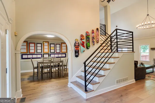 a view of entryway and dining room with furniture