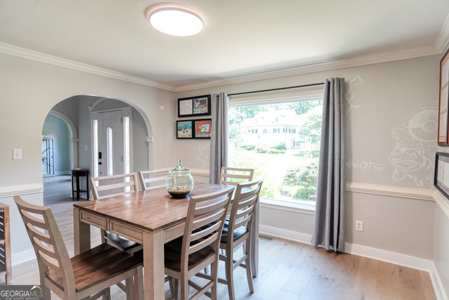 335 Butterfield Lane Fayetteville, GA 30214 - Photo 4 of 27 a view of a dining room with furniture window and wooden floor