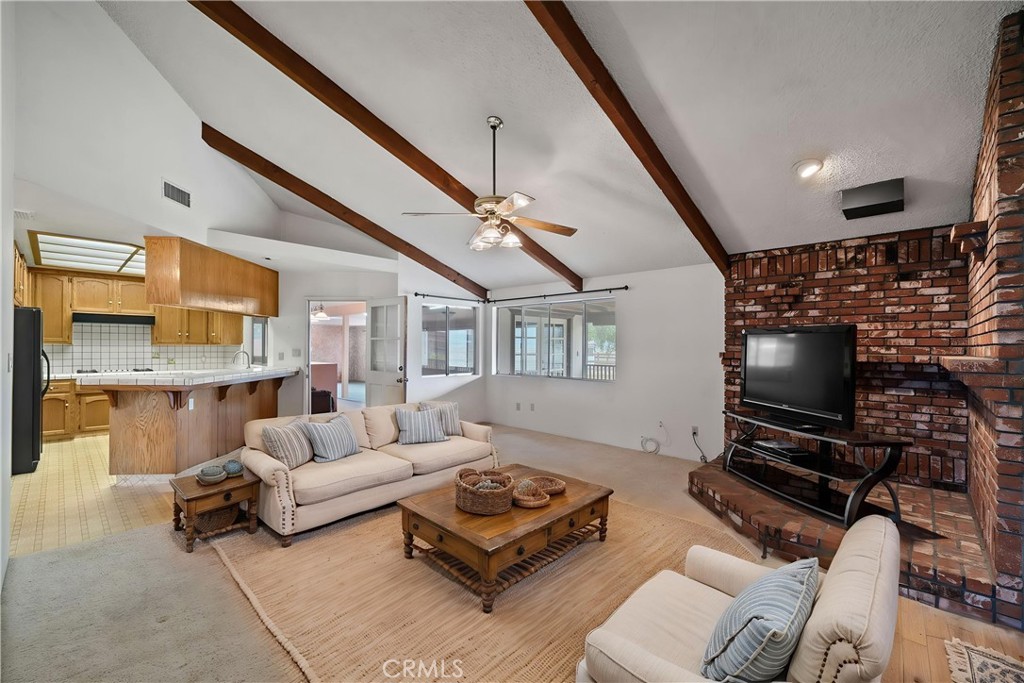 2065 Jenkins Road Bakersfield, CA 93314 - Photo 7 of 59 a living room with furniture and a flat screen tv