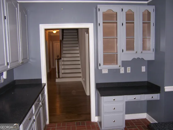 a kitchen with a sink and cabinets