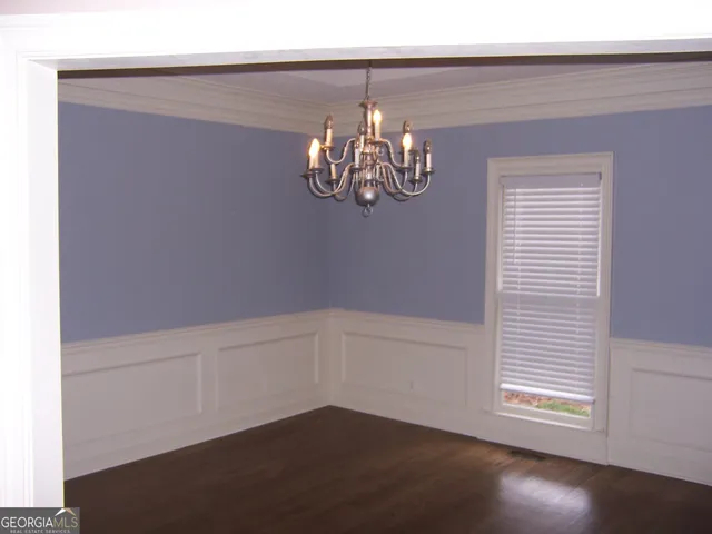 a view of a chandelier fan in a room