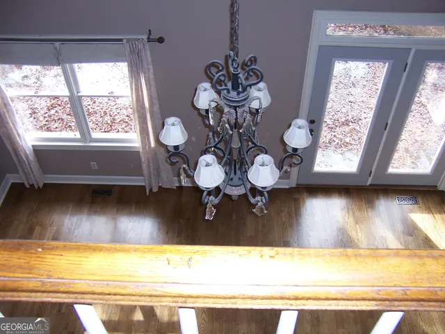 a view of a floor to ceiling window and a wooden floor