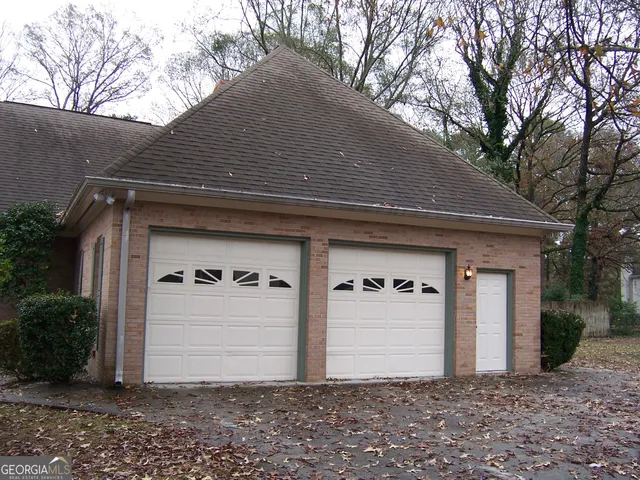 a front view of a house with garage