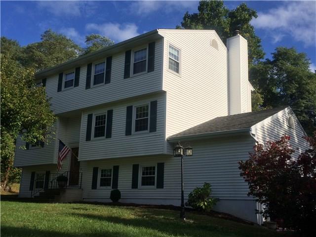 15 Chambers Road Danbury, CT 06811 - Photo 1 of 1 a front view of a house with a garden