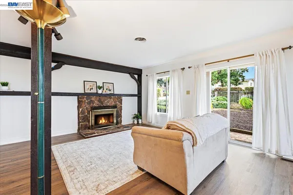 a kitchen with granite countertop wooden cabinets stainless steel appliances and a sink