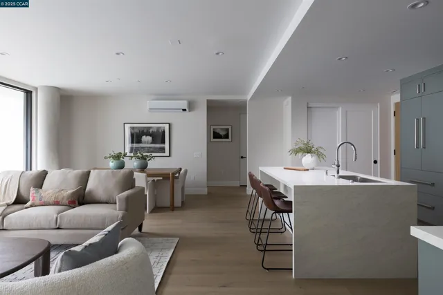 a living room with furniture a dining table and chairs
