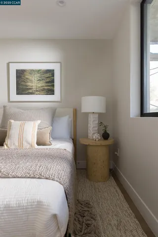 a bedroom with a bed and window