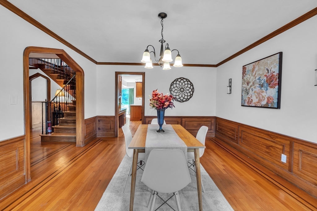 493 Salisbury Street Worcester, MA 01609 - Photo 12 of 42 a living room with furniture and a chandelier