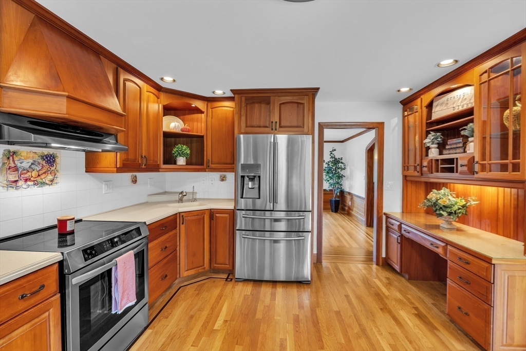 493 Salisbury Street Worcester, MA 01609 - Photo 13 of 42 a kitchen with stainless steel appliances a stove a sink and a refrigerator