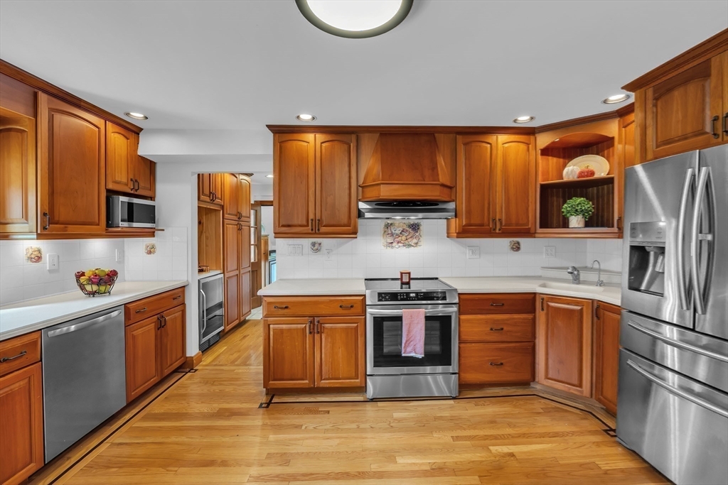 493 Salisbury Street Worcester, MA 01609 - Photo 16 of 42 a kitchen with stainless steel appliances granite countertop a refrigerator a stove top oven a sink and dishwasher