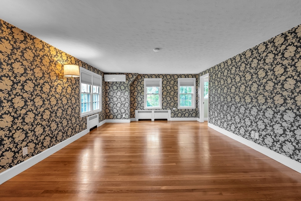 493 Salisbury Street Worcester, MA 01609 - Photo 25 of 42 a view of an empty room with wooden floor and a window