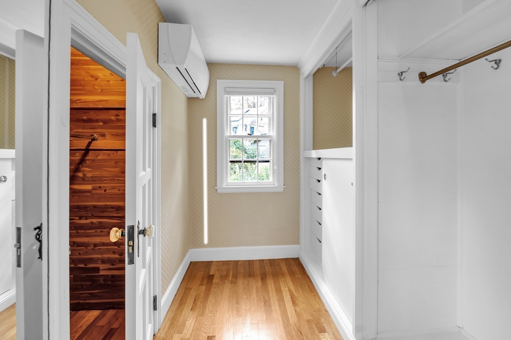493 Salisbury Street Worcester, MA 01609 - Photo 26 of 42 a view of a hallway with wooden floor and staircase