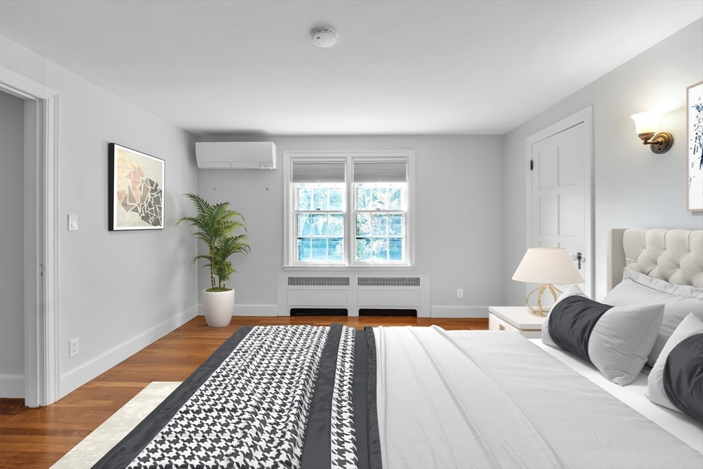 493 Salisbury Street Worcester, MA 01609 - Photo 29 of 42 a spacious bedroom with a bed and a window