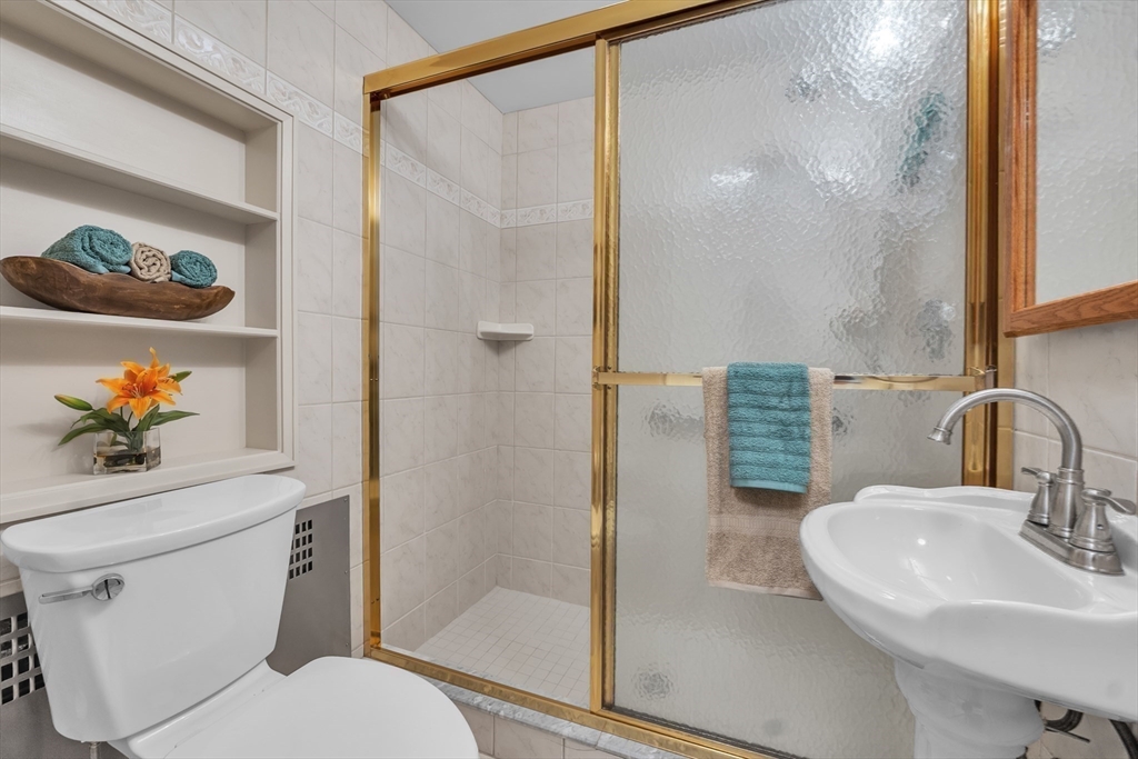 493 Salisbury Street Worcester, MA 01609 - Photo 35 of 42 a bathroom with a sink toilet and shower