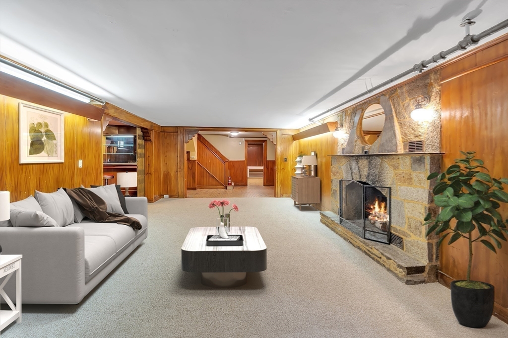 493 Salisbury Street Worcester, MA 01609 - Photo 38 of 42 a living room with furniture and a fireplace