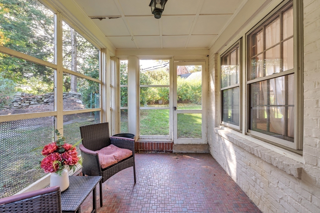 493 Salisbury Street Worcester, MA 01609 - Photo 39 of 42 a living room filled with furniture and a floor to ceiling window