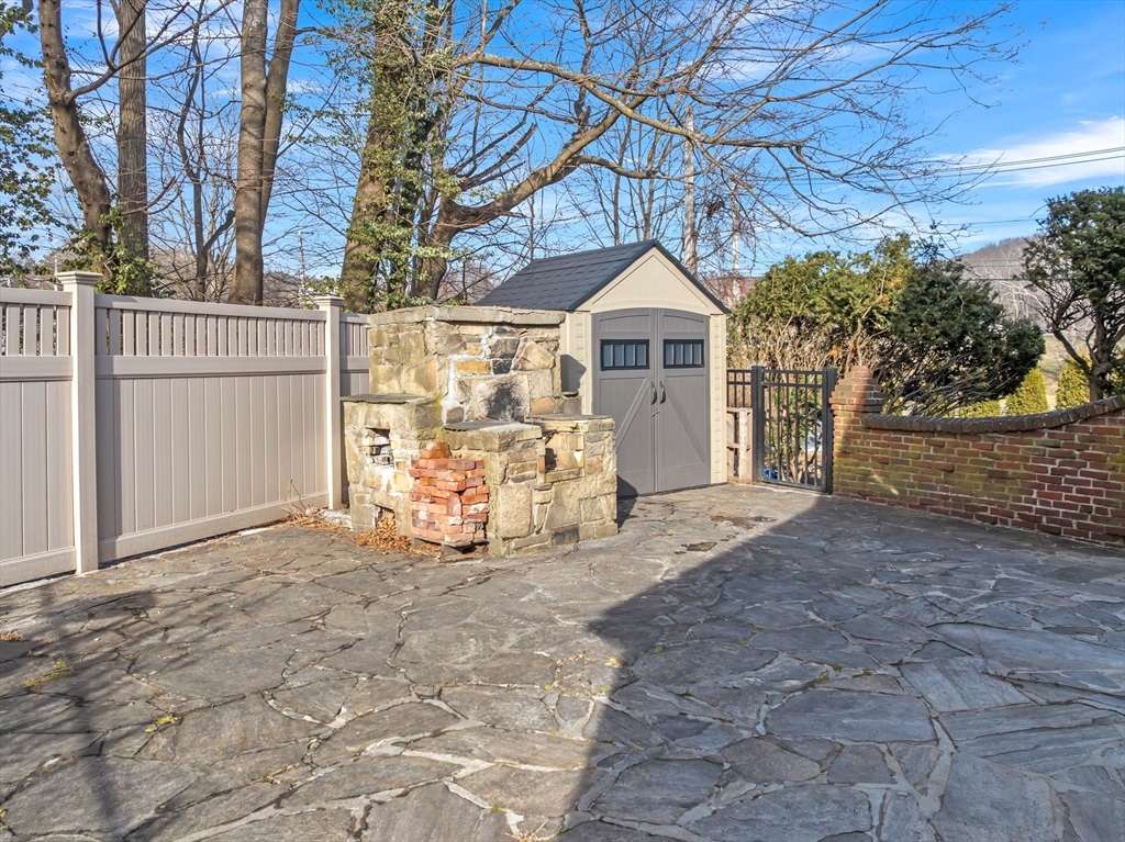 493 Salisbury Street Worcester, MA 01609 - Photo 40 of 42 a view of a house with a yard and garage