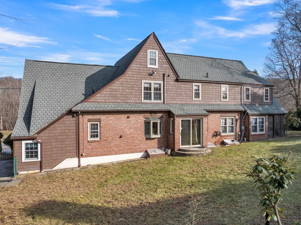 493 Salisbury Street Worcester, MA 01609 - Photo 41 of 42 a front view of a house with garden