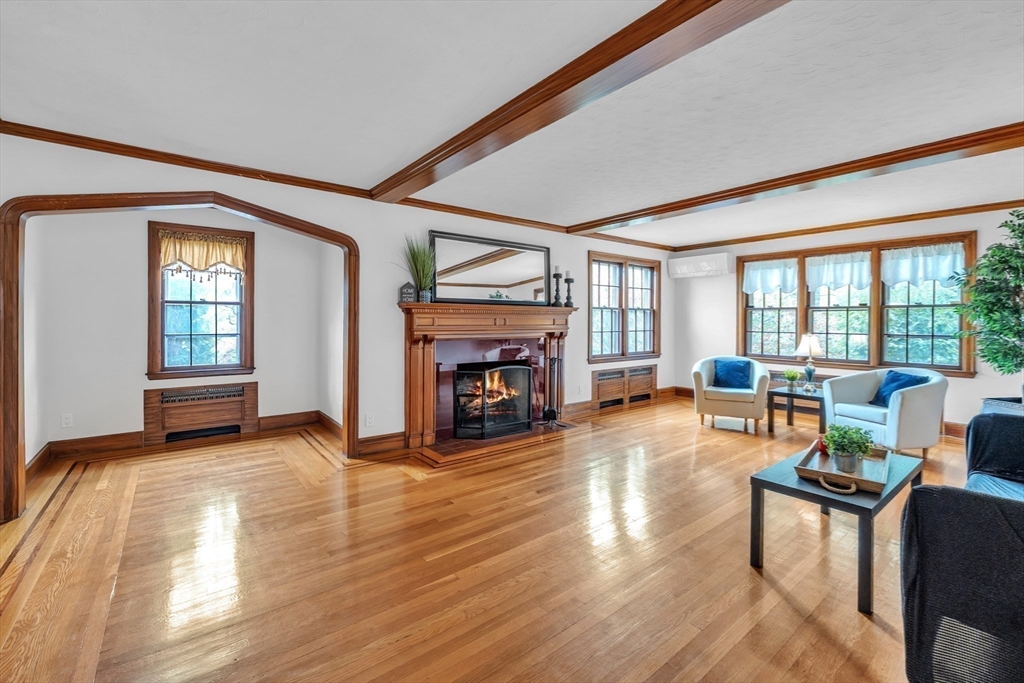 493 Salisbury Street Worcester, MA 01609 - Photo 6 of 42 a living room with fireplace furniture and a large window