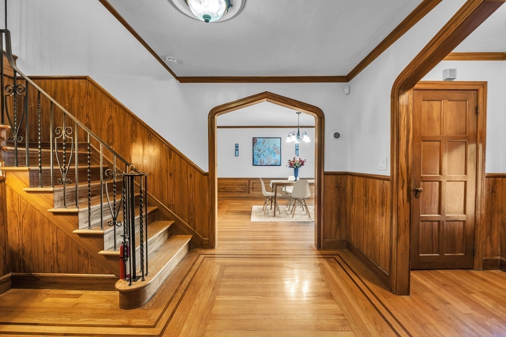 493 Salisbury Street Worcester, MA 01609 - Photo 10 of 42 a view of a hallway with wooden floor and staircase