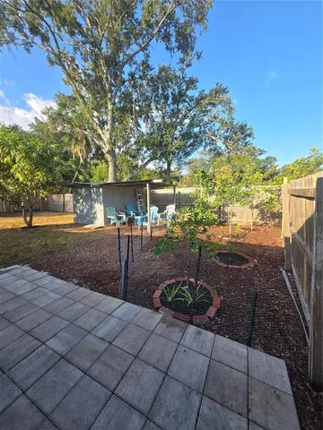 a backyard of a house with lots of green space