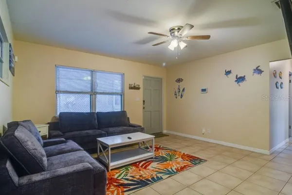 a living room with furniture and a window