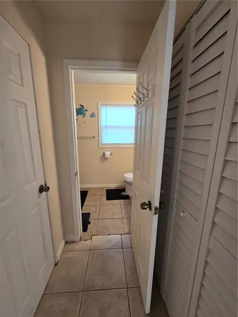 a view of a closet in a bathroom