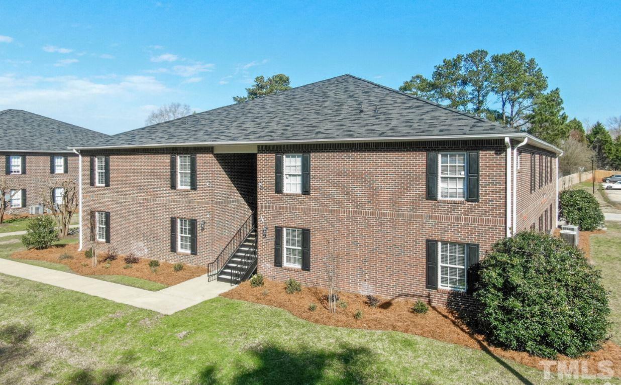 21 Collins Drive, Unit C Lillington, NC 27546 - Photo 1 of 13 a front view of a house with a yard