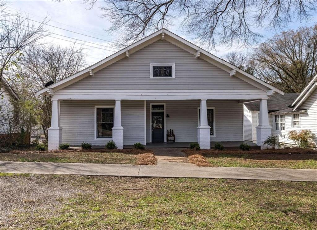 1120 East 2nd Street Southeast Rome, GA 30161 - Photo 1 of 1 a house that has a big yard in front of it