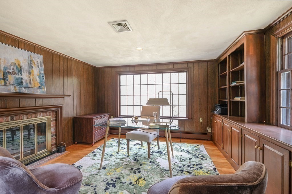 73 Draper Road Wayland, MA 01778 - Photo 3 of 13 a living room with furniture and a fireplace