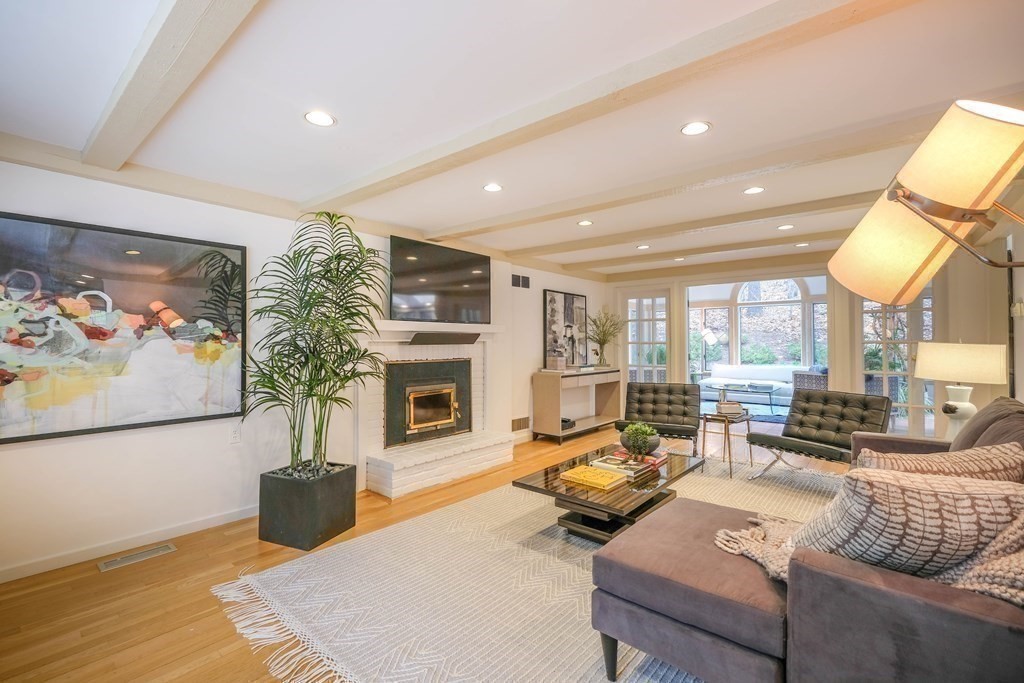 73 Draper Road Wayland, MA 01778 - Photo 4 of 13 a living room with furniture fireplace and a large window