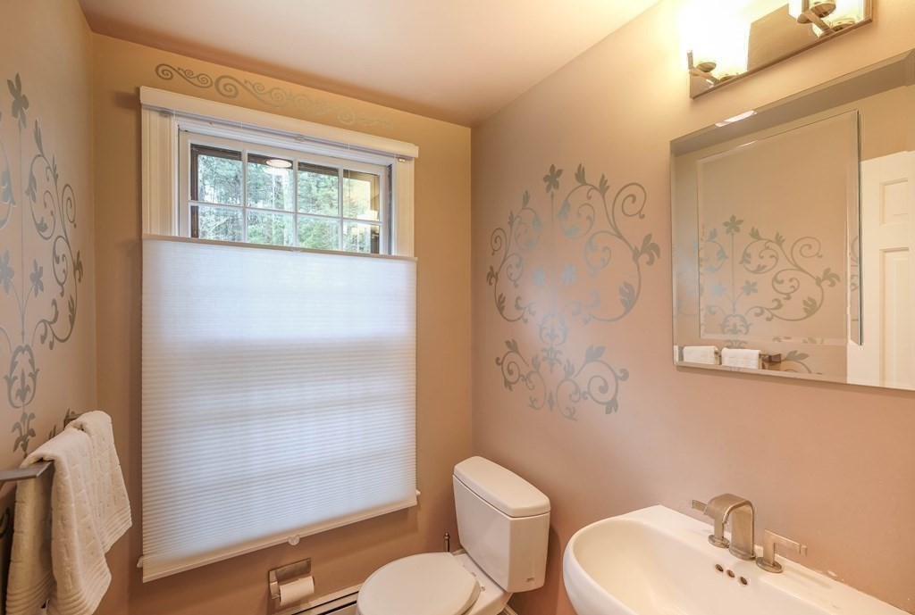 73 Draper Road Wayland, MA 01778 - Photo 6 of 13 a bathroom with a sink mirror and a toilet