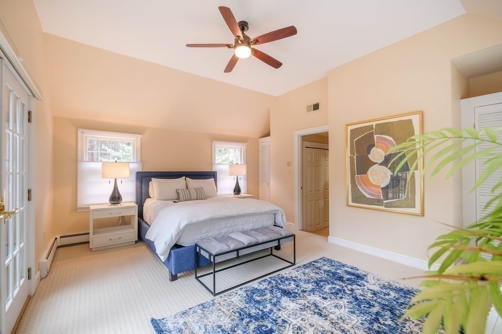 73 Draper Road Wayland, MA 01778 - Photo 7 of 13 a bedroom with a bed and painting on the wall