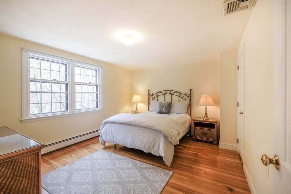 73 Draper Road Wayland, MA 01778 - Photo 8 of 13 a bedroom with a bed and window