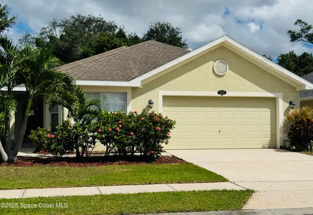 a front view of house with garden