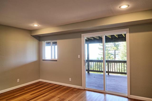 252 Swett Road Woodside, CA 94062 - Photo 11 of 21 a view of an empty room with wooden floor and a window