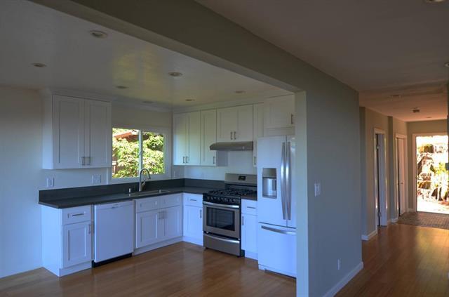 252 Swett Road Woodside, CA 94062 - Photo 3 of 21 a kitchen with stainless steel appliances granite countertop a sink and a stove next to a window
