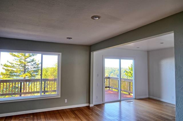 252 Swett Road Woodside, CA 94062 - Photo 4 of 21 a view of an empty room with wooden floor and a window