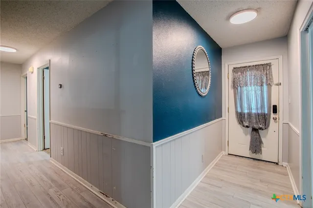 a view of entryway with wooden floor