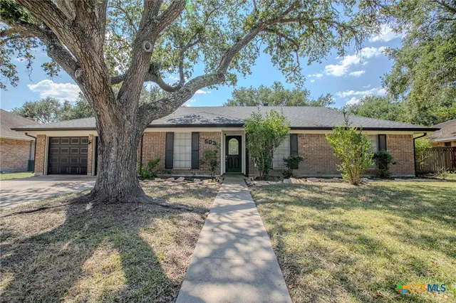 front view of a house with a trees