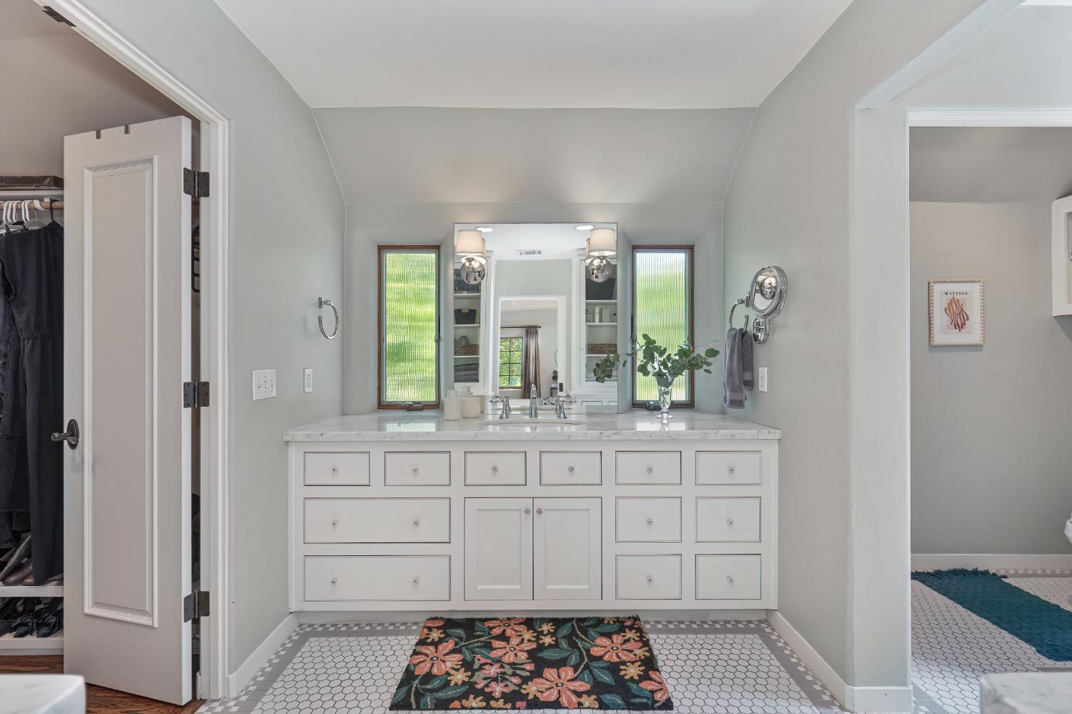 3501 Cutter Way Sacramento, CA 95818 - Photo 47 of 89 a spacious bathroom with a double vanity sink a mirror and a shower