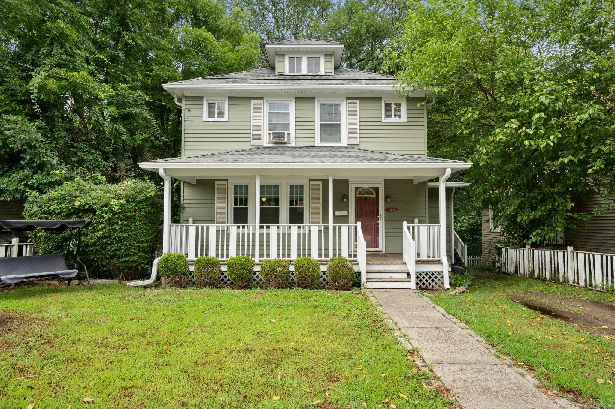 144 Washington Street Norwich, CT 06360 - Photo 1 of 1 a front view of a house with garden