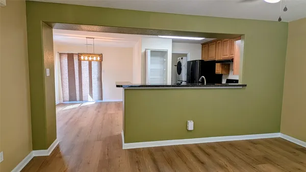 a kitchen with stainless steel appliances a stove a refrigerator and a sink