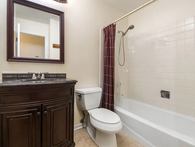 a bathroom with a shower and a sink