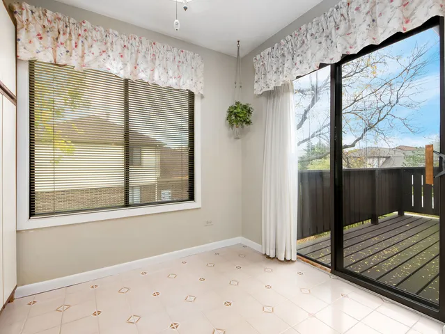 a bathroom with a sink vanity mirror and toilet