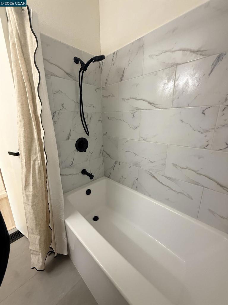 60 Wilson Way Milpitas, CA 95035 - Photo 18 of 22 a bathroom with a bath tub with a shower