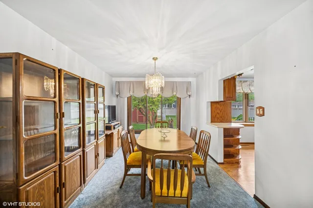 a view of a dining room with furniture window and outside view