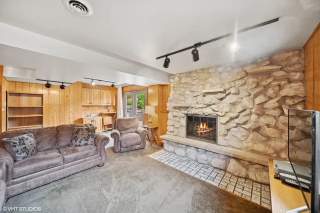 a living room with furniture and a fireplace