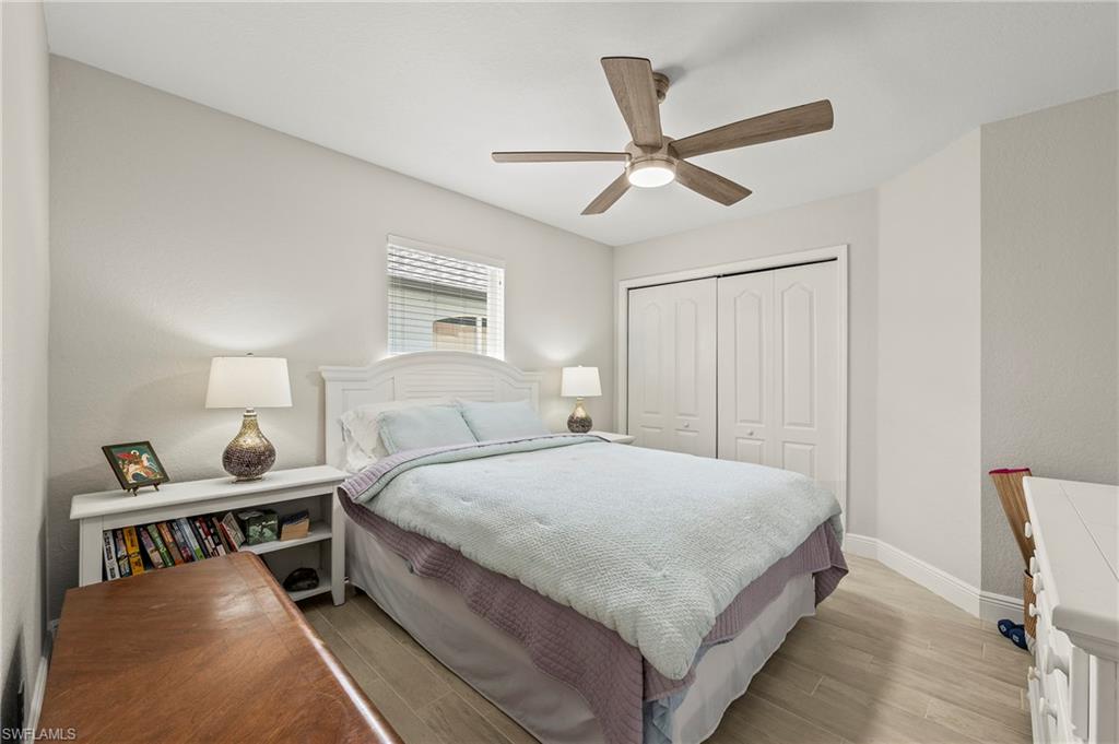 2039 Terrazzo Lane Naples, FL 34104 - Photo 15 of 29 a bedroom with a bed and window