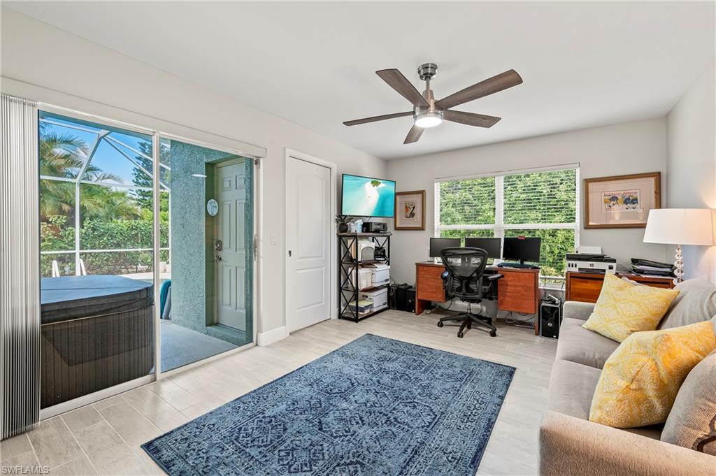 2039 Terrazzo Lane Naples, FL 34104 - Photo 18 of 29 a living room with furniture and a large window